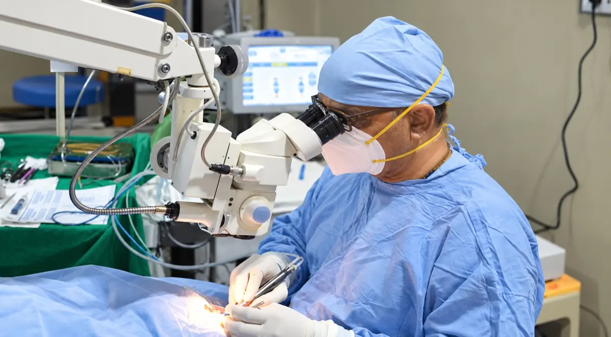 Eye surgeon performing microsurgery at Mookambika Modi Eye Hospital Tumkur